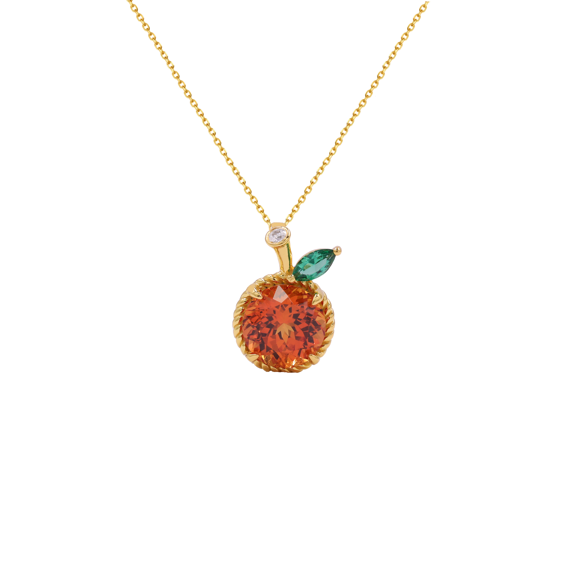 A gold necklace with an orange-shaped pendant featuring a faceted orange-red center, a small green marquise gemstone leaf, and a tiny clear accent stone on a white background.