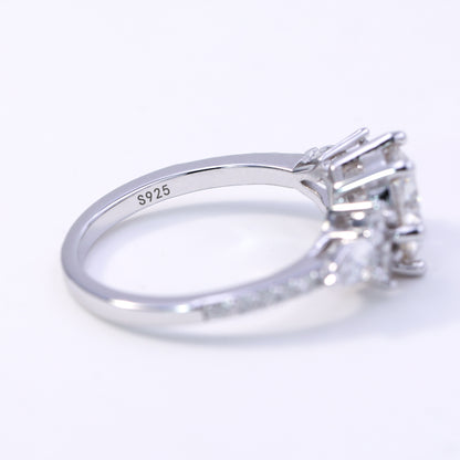 Silver ring with a diamond on a white background